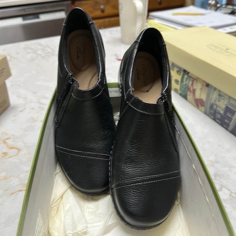 Size 7. Women’s black Clark’s flats. Never worn.